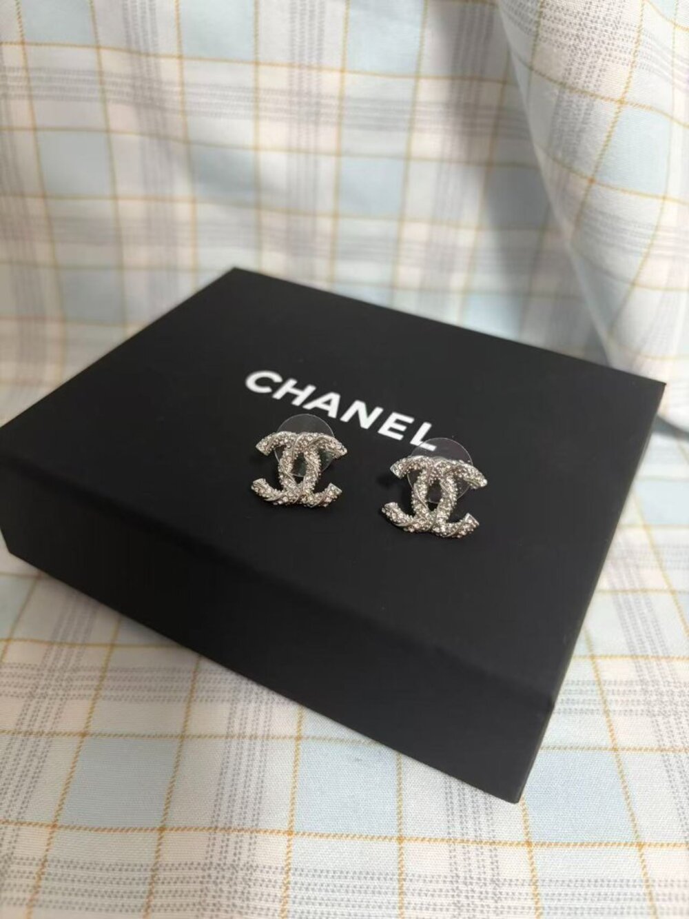 Chanel iconic interlocking CC stud earrings.